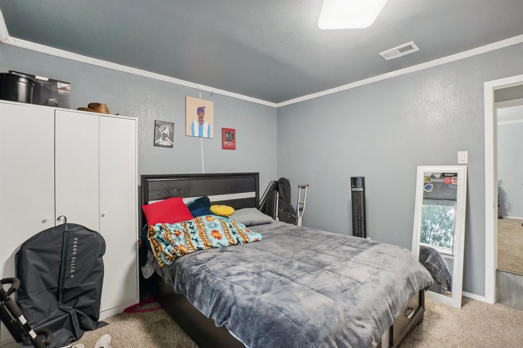 3601 Chime Street Irving, TX 75062 - Photo 12 of 17 a bedroom with a bed and a couch