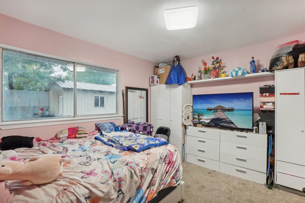 3601 Chime Street Irving, TX 75062 - Photo 14 of 17 a bedroom with a bed and a dresser