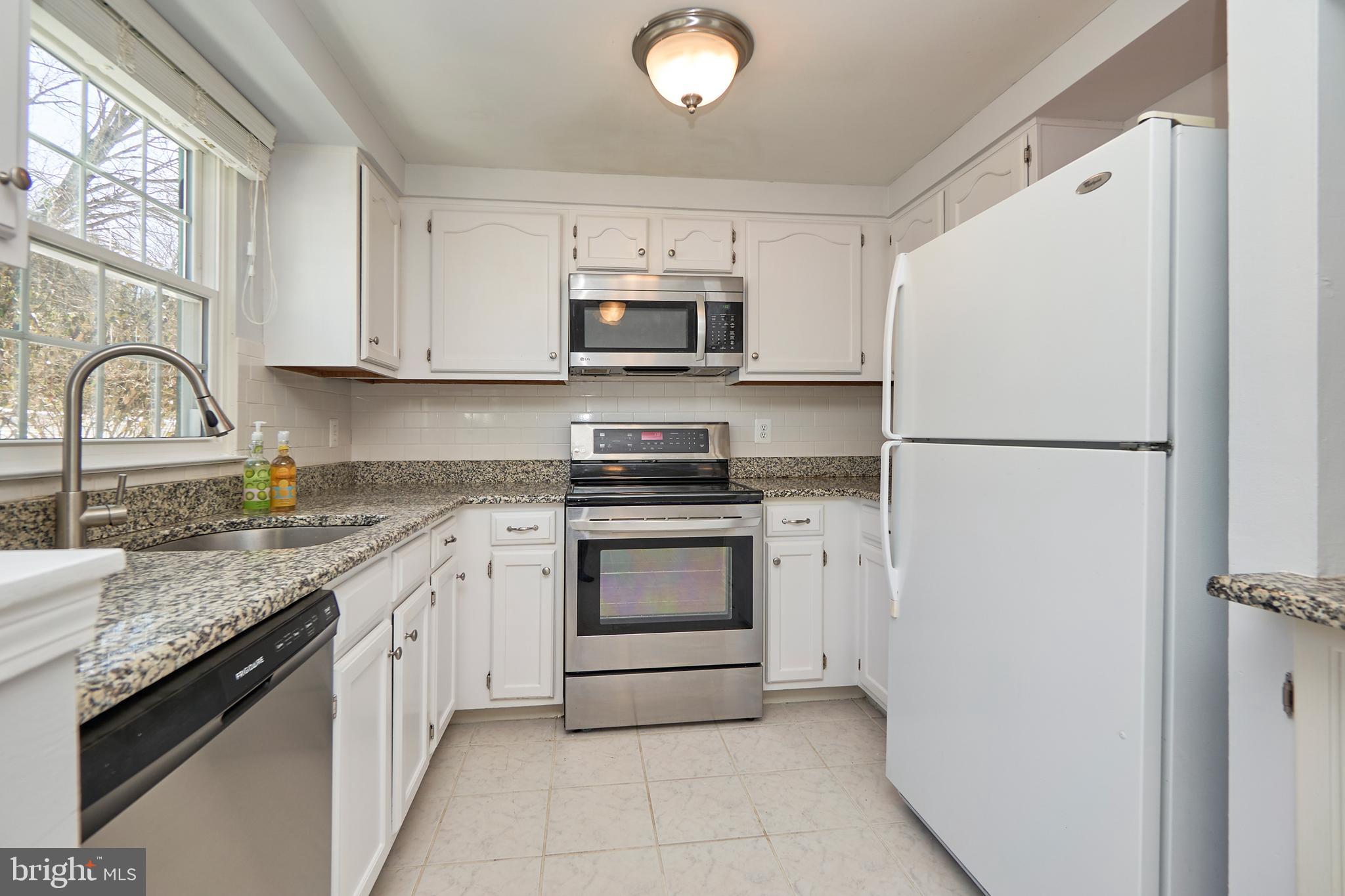 1676 Bayfield Way Reston, VA 20194 - Photo 12 of 30 Upgraded kitchen with granite counters