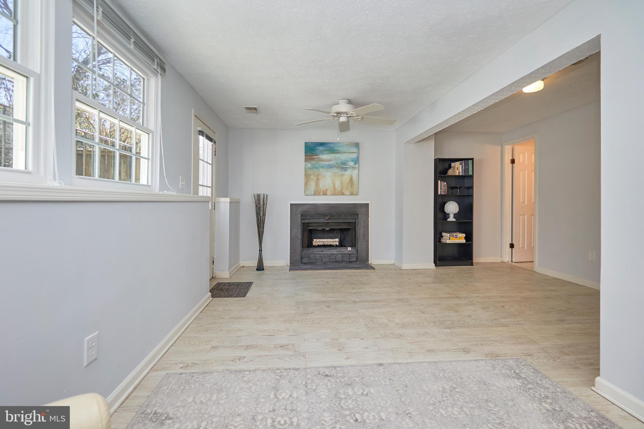 1676 Bayfield Way Reston, VA 20194 - Photo 22 of 30 Family room with fireplace, door to backyard
