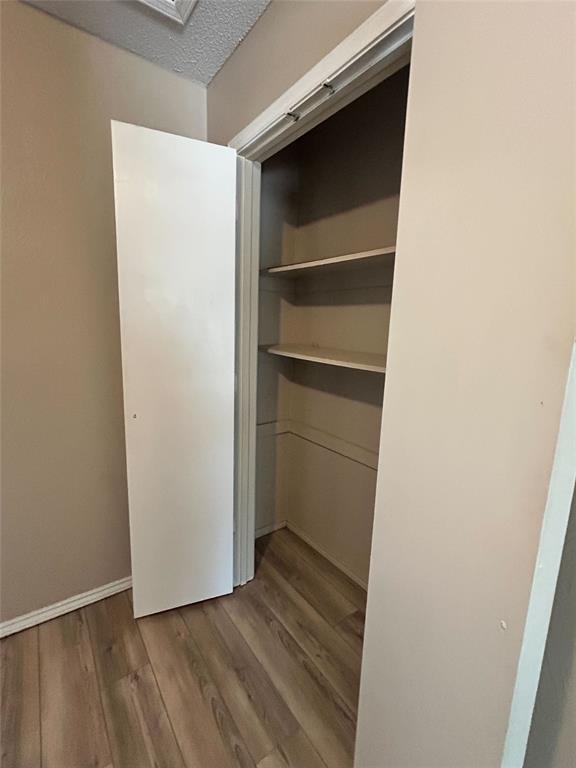 2818 South Fielder Road Arlington, TX 76015 - Photo 17 of 31 a view of an empty walk in closet