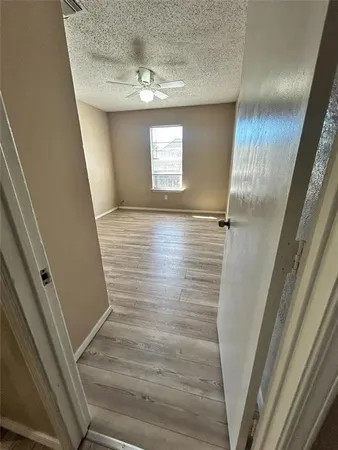 a view of a livingroom with wooden floor and closet