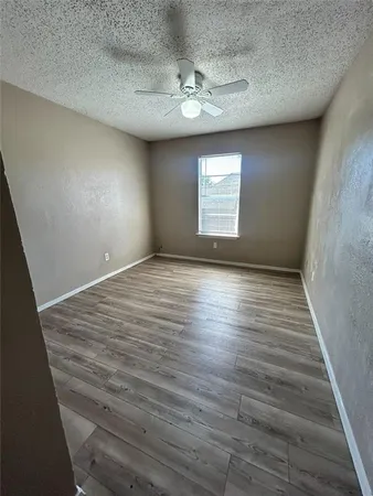 a view of a bathroom with a sink and a mirror