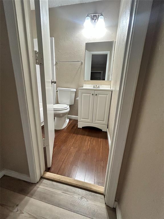 2818 South Fielder Road Arlington, TX 76015 - Photo 30 of 31 a view of a bathroom with a sink and a mirror