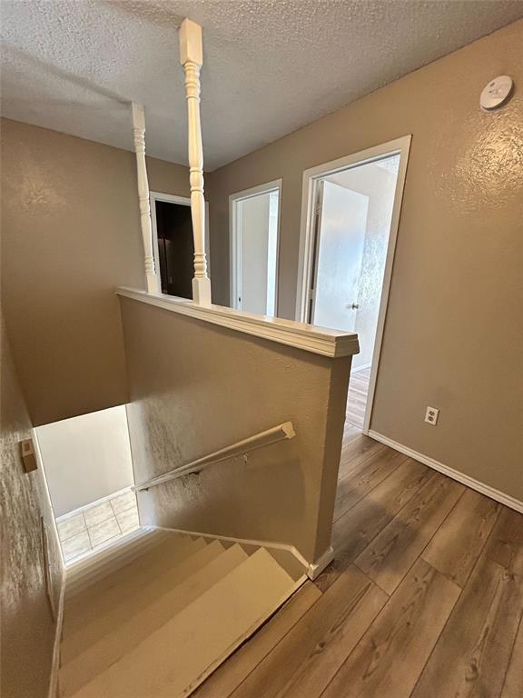 2818 South Fielder Road Arlington, TX 76015 - Photo 8 of 31 a view of wooden floor and chair in a room