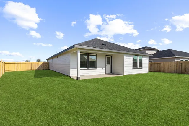 a view of a house with a back yard