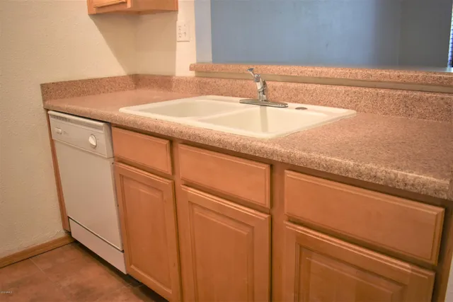an empty room with wooden floor and a window