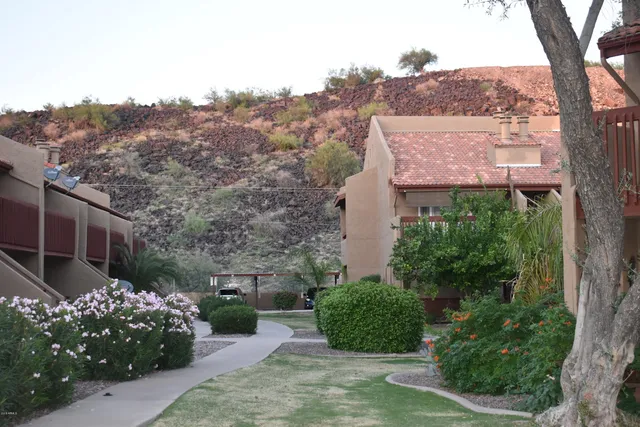 a living room with a black white checkered floor