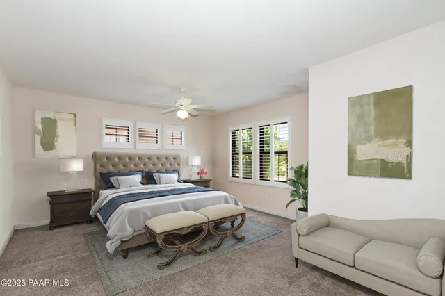 a bedroom with a large bed and a window