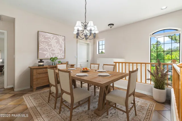 a large kitchen with lots of counter space and furniture