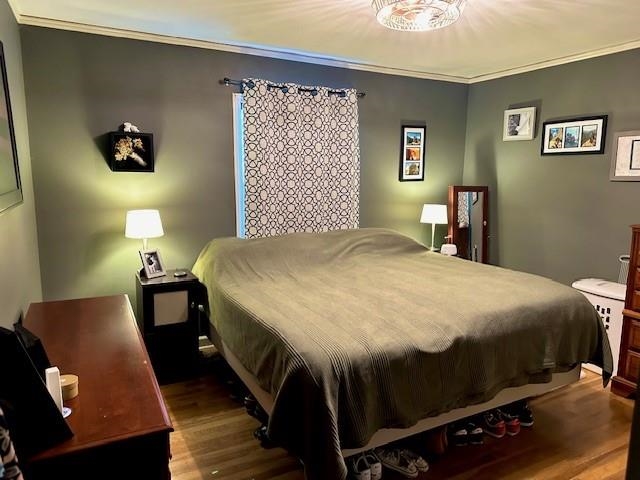 4992 Princeton Road Memphis, TN 38117 - Photo 11 of 13 a bed sitting in a bedroom next to a window