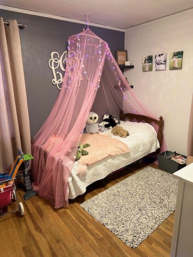 4992 Princeton Road Memphis, TN 38117 - Photo 10 of 13 a bed sitting in a bedroom next to a window