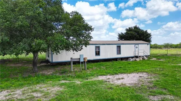 a view of a pathway with a yard