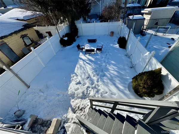 a roof deck view with the couches and a potted plant