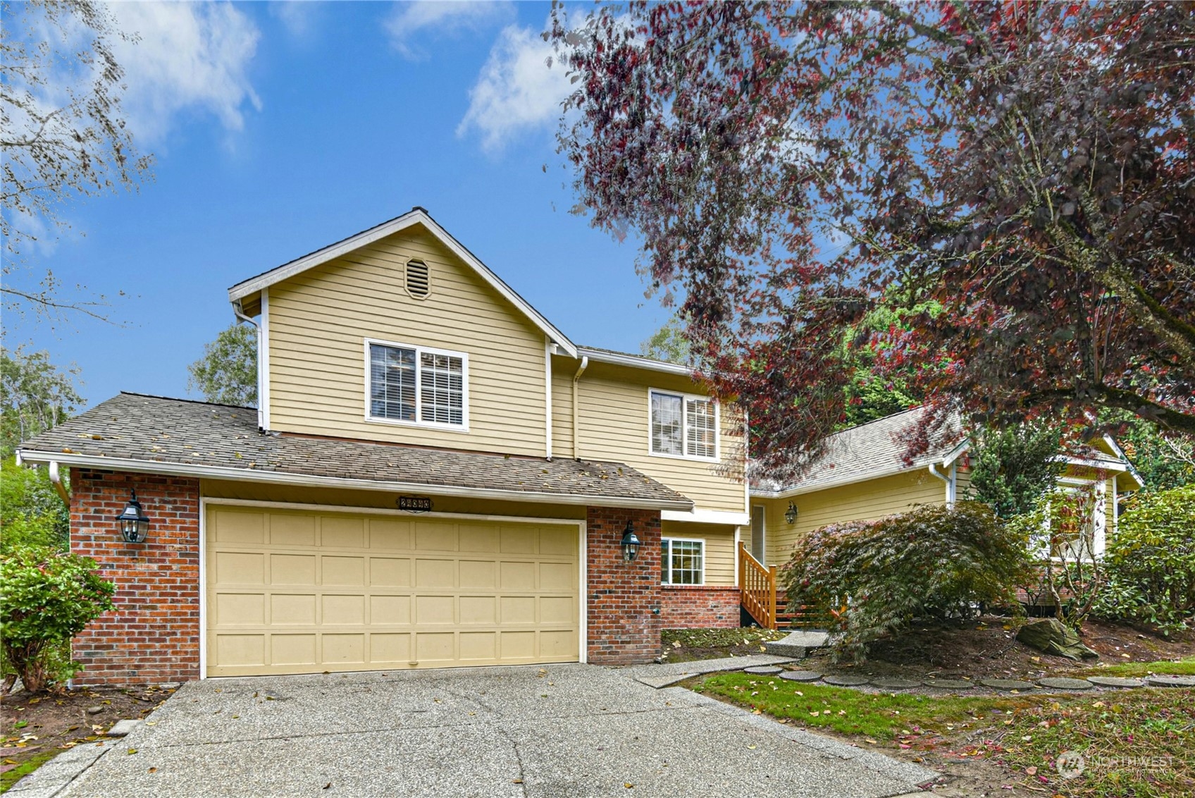 24040 Brier Road Brier, WA 98036 - Photo 2 of 37 a front view of a house with a yard and garage