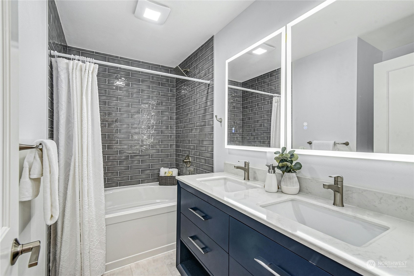 24040 Brier Road Brier, WA 98036 - Photo 21 of 37 a bathroom with a granite countertop sink mirror toilet and bathtub