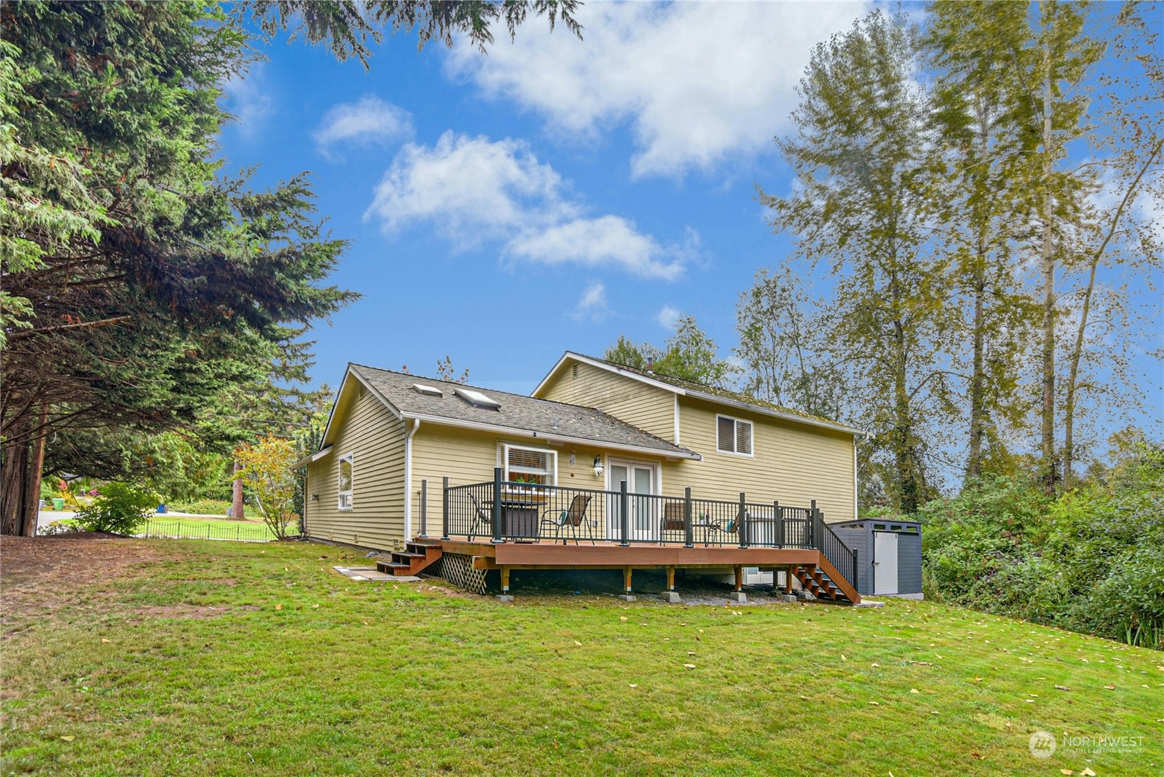 24040 Brier Road Brier, WA 98036 - Photo 30 of 37 a aerial view of a house with yard and large trees