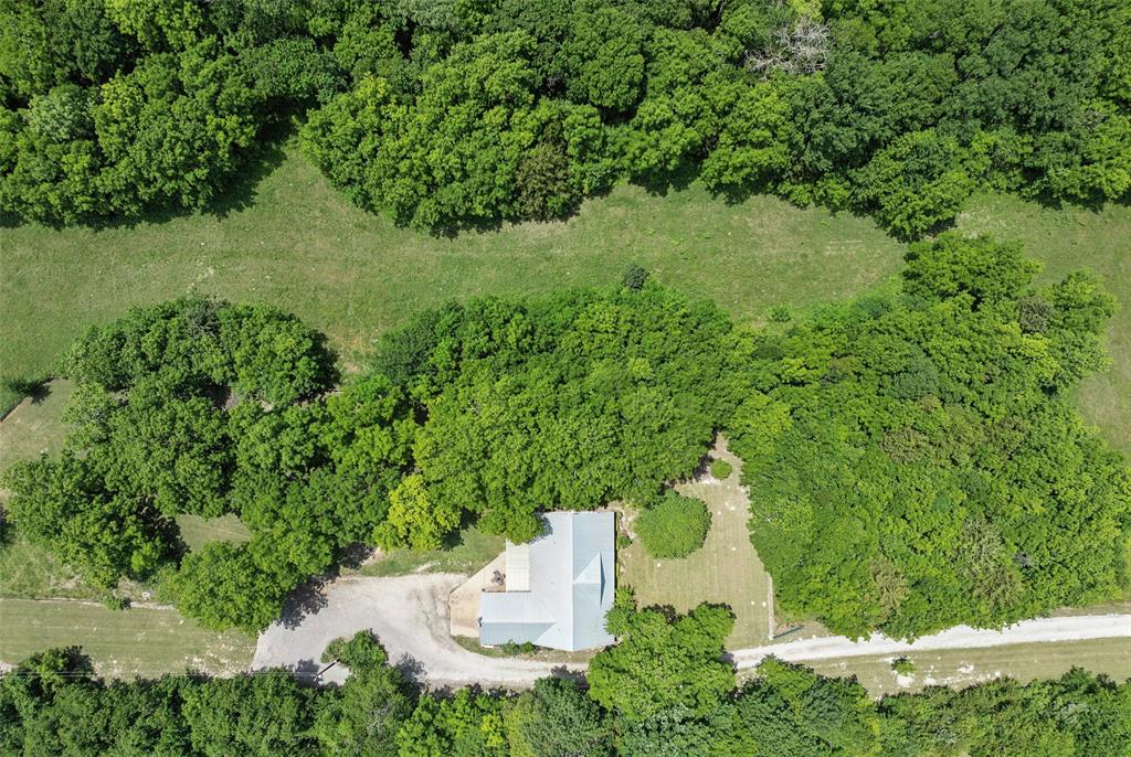 1000 Ballard Road Van Alstyne, TX 75495 - Photo 34 of 40 an aerial view of a house with a yard