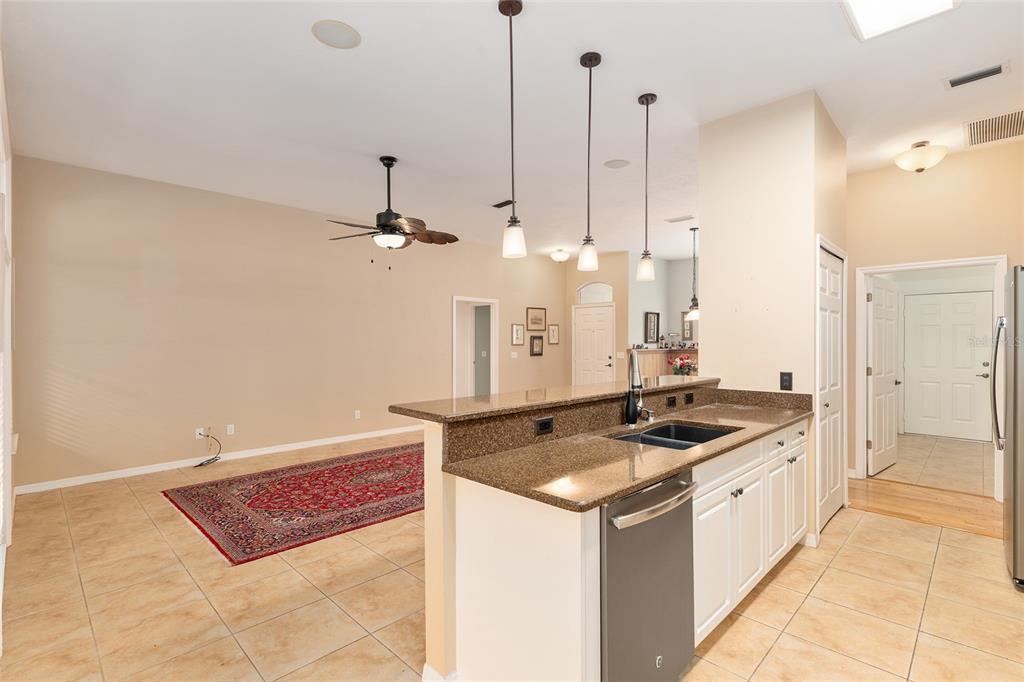 10160 Southwest 48th Place Gainesville, FL 32608 - Photo 14 of 68 a kitchen with a stove a refrigerator a sink and dishwasher