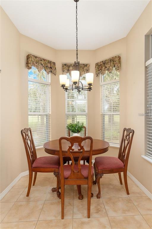 10160 Southwest 48th Place Gainesville, FL 32608 - Photo 15 of 68 a view of a dining room with furniture window and outside view