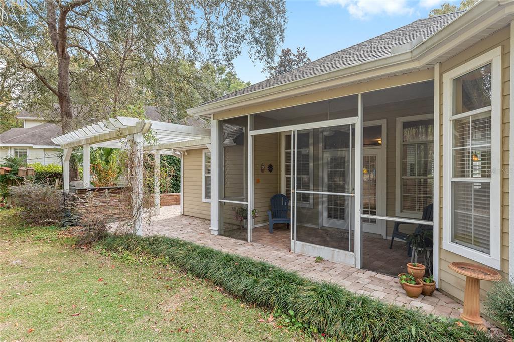 10160 Southwest 48th Place Gainesville, FL 32608 - Photo 44 of 68 a view of a house with backyard porch and sitting area