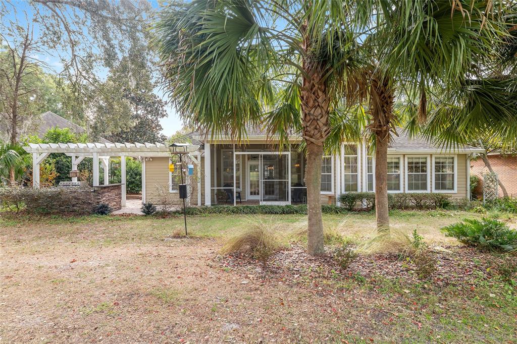 10160 Southwest 48th Place Gainesville, FL 32608 - Photo 49 of 68 a view of a house with a yard and sitting area