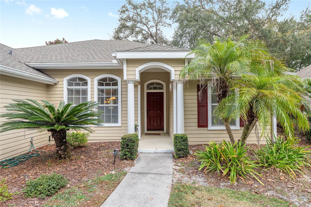 10160 Southwest 48th Place Gainesville, FL 32608 - Photo 63 of 68 a front view of a house with a garden