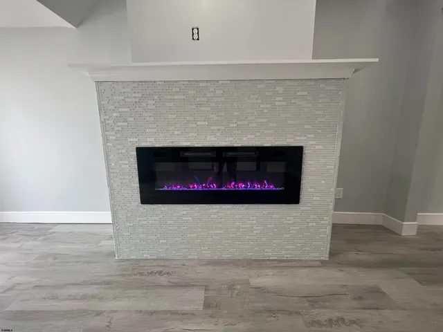 a living room with a fireplace