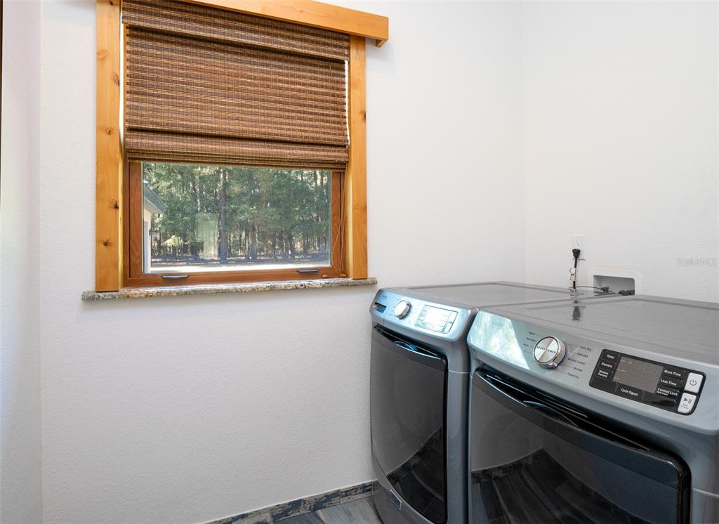 3 Carry Back Road Ocala, FL 34482 - Photo 18 of 37 a view of a room with a car parked in it