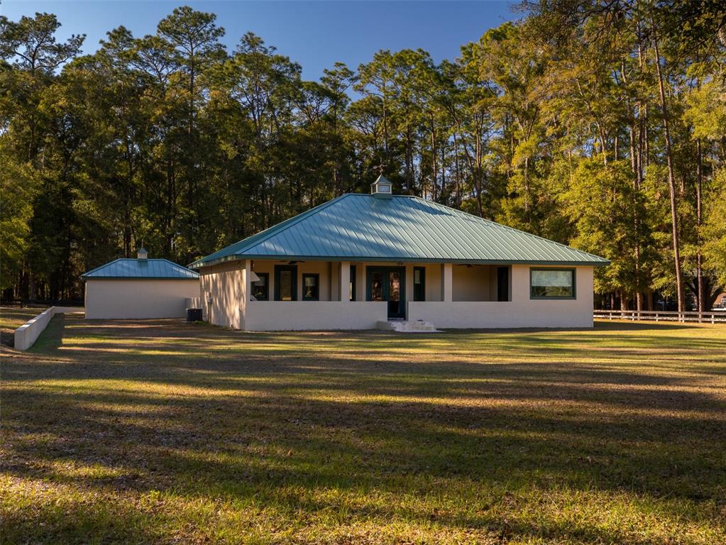 3 Carry Back Road Ocala, FL 34482 - Photo 20 of 37 a front view of a house with a big yard