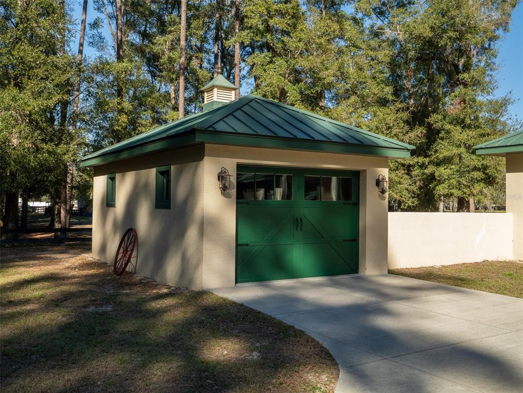 3 Carry Back Road Ocala, FL 34482 - Photo 22 of 37 a front view of a house with a yard and garage