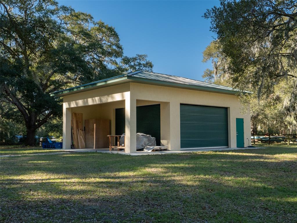 3 Carry Back Road Ocala, FL 34482 - Photo 23 of 37 a view of a house with a backyard