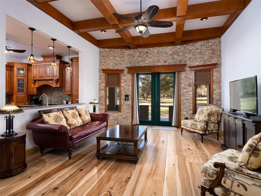 3 Carry Back Road Ocala, FL 34482 - Photo 6 of 37 a view of a patio with couches table and chairs with wooden floor