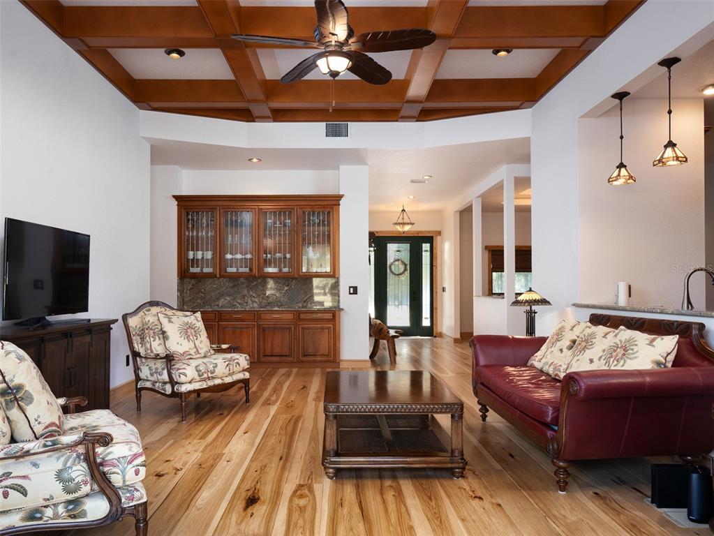 3 Carry Back Road Ocala, FL 34482 - Photo 7 of 37 a living room with furniture and a flat screen tv