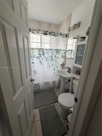 a bathroom with a sink and a toilet