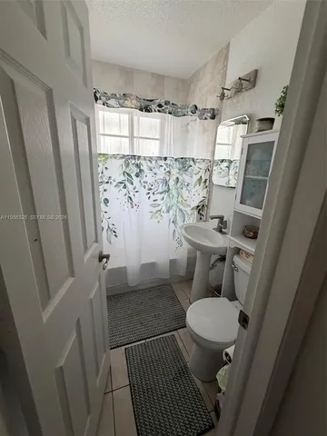 a bathroom with a sink and a toilet