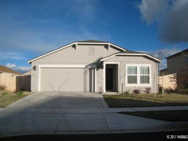 8960 Yeager Street Reno, NV 89506 - Photo 1 of 10 a front view of a house with a yard