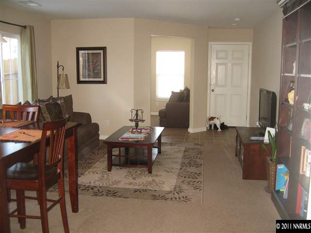 8960 Yeager Street Reno, NV 89506 - Photo 3 of 10 a view of a livingroom with furniture and a window