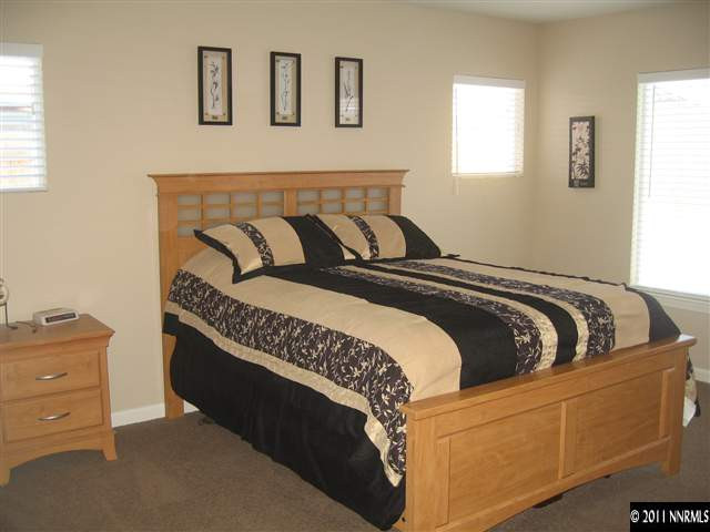 8960 Yeager Street Reno, NV 89506 - Photo 6 of 10 a bedroom with bed and window