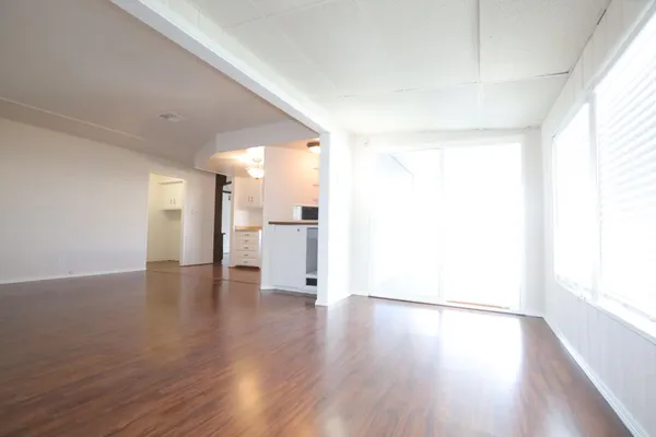 a view of a livingroom with wooden floor