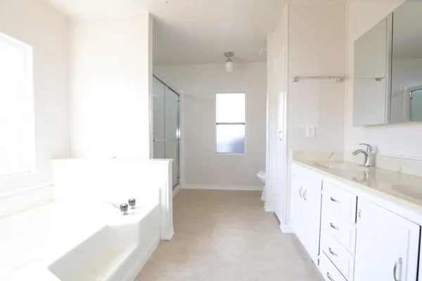 a bathroom with a glass shower door