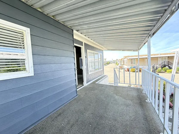 a view of a porch with furniture