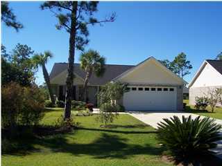 203 Bay Grove Road Freeport, FL 32439 - Photo 2 of 12 a front view of a house with garden