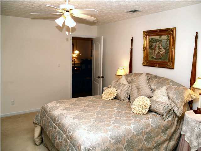 203 Bay Grove Road Freeport, FL 32439 - Photo 6 of 12 a bedroom with a bed and a painting on the wall