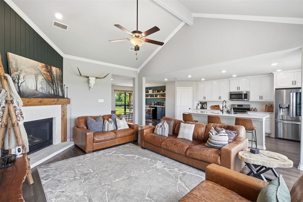 2990 Wilson Road Palmer, TX 75152 - Photo 12 of 40 a living room with furniture and a fireplace