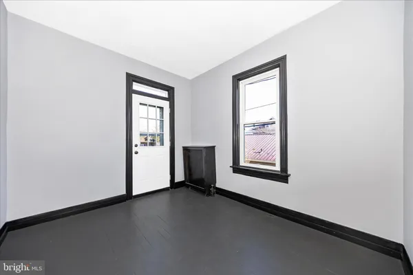 an empty room with windows