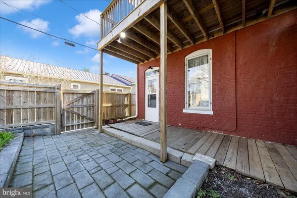 a view of a balcony with wooden floor