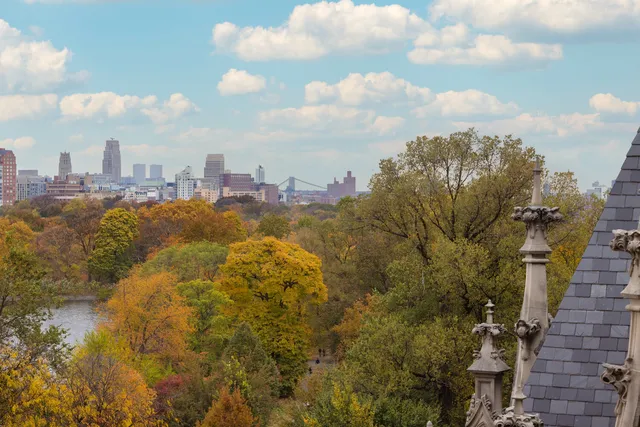 a bathroom with a shower a mirror and a sink