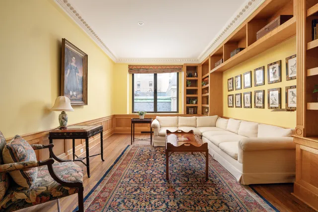 a kitchen with stainless steel appliances kitchen island granite countertop a sink a stove a dining table and chairs