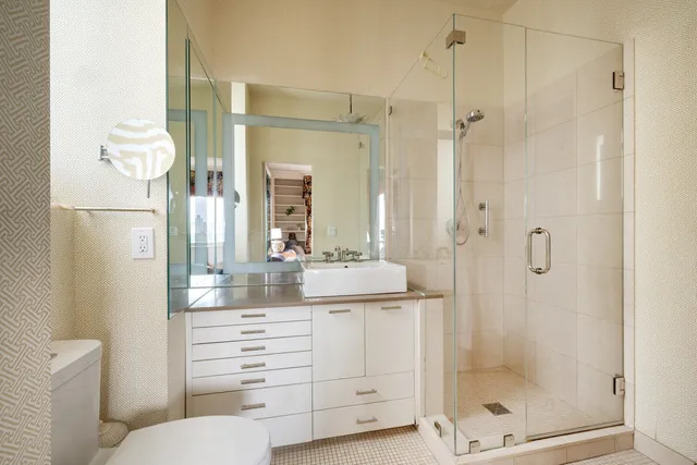 a living room with furniture and large windows